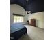A bedroom featuring a cozy carpet, ceiling fan, and natural light from a window at 105 Hein Dr, Clayton, NC 27527