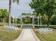 Elegant outdoor wedding ceremony setup with white chairs and floral decorations, perfect for a memorable event at 105 Hein Dr, Clayton, NC 27527