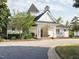 Charming clubhouse featuring a covered porch with columns and manicured landscaping at 105 Hein Dr, Clayton, NC 27527