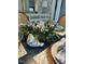 Up close view of a blue-themed table setting with bird decorations in a stylish dining area at 105 Hein Dr, Clayton, NC 27527