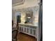 Dining room with lovely wallpaper, a buffet, and wood floors at 105 Hein Dr, Clayton, NC 27527