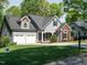 Beautiful home with manicured lawn, two-car garage, and charming curb appeal at 105 Hein Dr, Clayton, NC 27527