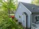 Exterior shot of a home's side, showcasing the landscaping, outdoor air conditioning unit, and house architecture at 105 Hein Dr, Clayton, NC 27527