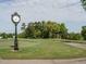 Well-maintained golf course with a vintage-style clock overlooking the green, adding a touch of elegance at 105 Hein Dr, Clayton, NC 27527