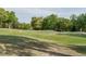 Scenic golf course with rolling hills, lush greenery, and mature trees, ideal for a relaxing day of golfing at 105 Hein Dr, Clayton, NC 27527