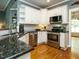 Well-equipped kitchen featuring granite countertops, stainless steel appliances, and ample cabinet space at 105 Hein Dr, Clayton, NC 27527