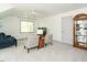 Comfortable living area with plush seating, soft carpet, and a display cabinet for storage at 105 Hein Dr, Clayton, NC 27527