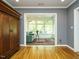 View of a comfortable living room and sunroom, with lots of natural light at 105 Hein Dr, Clayton, NC 27527