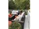 Relaxing outdoor deck with comfortable seating, decorative pillows, and lush greenery at 105 Hein Dr, Clayton, NC 27527