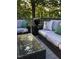Stylish outdoor deck featuring comfortable seating, glass table and beautiful decor at 105 Hein Dr, Clayton, NC 27527