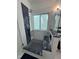Modern bathroom shower with glass door, white and blue tile and a rainfall shower head at 105 Hein Dr, Clayton, NC 27527