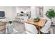 Open living space with a modern kitchen flows into a dining area and a well-lit living room at 106 Red Maple St, Sanford, NC 27332