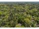 Expansive aerial view of a lush, heavily wooded area with a home nestled among the trees, suggesting privacy at 107 Deer St, Carrboro, NC 27510