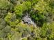 Aerial shot showcasing a home nestled amidst lush green trees, offering privacy and a serene atmosphere at 107 Deer St, Carrboro, NC 27510