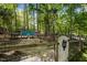 Backyard with a chicken coop featuring a white gate and blue shed at 107 Deer St, Carrboro, NC 27510
