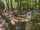View of the backyard featuring a chicken coop with a white decorative door at 107 Deer St, Carrboro, NC 27510