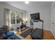 Bright workout room with modern exercise equipment and a large window bringing in natural light at 107 Deer St, Carrboro, NC 27510