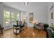Bright office space features hardwood floors, large windows with natural light, and neutral walls for a productive workspace at 107 Deer St, Carrboro, NC 27510