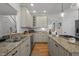 Spacious kitchen featuring granite countertops, stainless steel appliances, and ample cabinet space for modern convenience at 107 Deer St, Carrboro, NC 27510