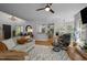 Open living space with hardwood floors, fireplace, ceiling fan and lots of natural light at 107 Deer St, Carrboro, NC 27510