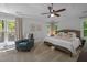 Relaxing bedroom with natural light and a ceiling fan at 107 Deer St, Carrboro, NC 27510