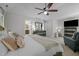 Spacious bedroom suite with a king bed, ceiling fan, and ensuite bathroom at 107 Deer St, Carrboro, NC 27510