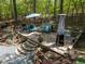 Backyard featuring a stone patio with comfortable seating and manicured landscaping at 107 Deer St, Carrboro, NC 27510