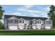 Charming townhome with a modern facade, well-manicured lawn, and attached garages at 108 Red Maple St, Sanford, NC 27332