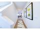Inviting hallway with wood floors, stylish decor, and a view of the open-concept living area at 108 Red Maple St, Sanford, NC 27332