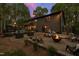 Enjoy a backyard with a fire pit, outdoor seating and patio under the magical glow of twilight at 10805 The Olde Pl, Raleigh, NC 27614