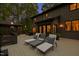 Backyard deck with three lounge chairs, outdoor dining table, and a gazebo for entertaining guests at 10805 The Olde Pl, Raleigh, NC 27614