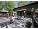 Expansive backyard deck featuring lounge chairs, hot tub, and dining area, perfect for outdoor relaxation at 10805 The Olde Pl, Raleigh, NC 27614