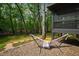Relaxing backyard hammock, complemented by stone pathways and serene views of the lush woods at 10805 The Olde Pl, Raleigh, NC 27614
