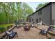 Picturesque backyard showcasing a fire pit, comfortable seating, and elegant landscaping at 10805 The Olde Pl, Raleigh, NC 27614