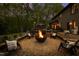 Cozy backyard fire pit surrounded by Adirondack chairs, creating the perfect spot to unwind at 10805 The Olde Pl, Raleigh, NC 27614