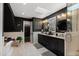 Luxurious bathroom with granite countertop, dark wood cabinetry, and glass shower, creating a spa-like retreat at 10805 The Olde Pl, Raleigh, NC 27614