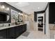 Beautiful bathroom featuring a granite countertop, dark wood cabinetry, and a modern glass-enclosed shower at 10805 The Olde Pl, Raleigh, NC 27614