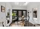 Cozy breakfast nook with views of the backyard features skylights and dark wood flooring at 10805 The Olde Pl, Raleigh, NC 27614