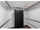Walk-in closet features custom shelving and built-in storage for optimal organization at 10805 The Olde Pl, Raleigh, NC 27614