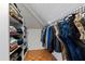The walk-in closet has built-in shelving and hanging racks for organized storage at 10805 The Olde Pl, Raleigh, NC 27614
