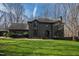 Attractive two-story home with a well-kept lawn, complemented by the surrounding mature trees at 10805 The Olde Pl, Raleigh, NC 27614