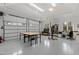Bright white garage featuring a workspace, storage shelves, and a double-car garage door at 10805 The Olde Pl, Raleigh, NC 27614