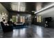 Well-lit garage with living area, hardwood-look flooring, and a full view of the backyard at 10805 The Olde Pl, Raleigh, NC 27614