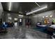 Spacious garage with painted floor and walls, plus a gym and living area at 10805 The Olde Pl, Raleigh, NC 27614