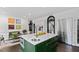 Kitchen island has seating, storage, and a sink, perfect for meal prep and entertaining at 10805 The Olde Pl, Raleigh, NC 27614
