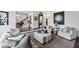 Open-concept living room showcasing hardwood floors, stylish furnishings, and seamless flow to dining and foyer at 10805 The Olde Pl, Raleigh, NC 27614