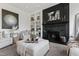 Comfortable living room featuring a fireplace with built-in shelving and a decorative arrangement, creating a cozy atmosphere at 10805 The Olde Pl, Raleigh, NC 27614