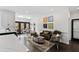Open-concept living room features a breakfast nook and connects to the kitchen with seating at 10805 The Olde Pl, Raleigh, NC 27614