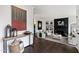 Bright and airy living room showcasing hardwood floors, stylish decor, and a cozy seating area with a fireplace at 10805 The Olde Pl, Raleigh, NC 27614