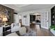 Open concept: living room connects seamlessly to bedroom with elegant French doors at 10805 The Olde Pl, Raleigh, NC 27614
